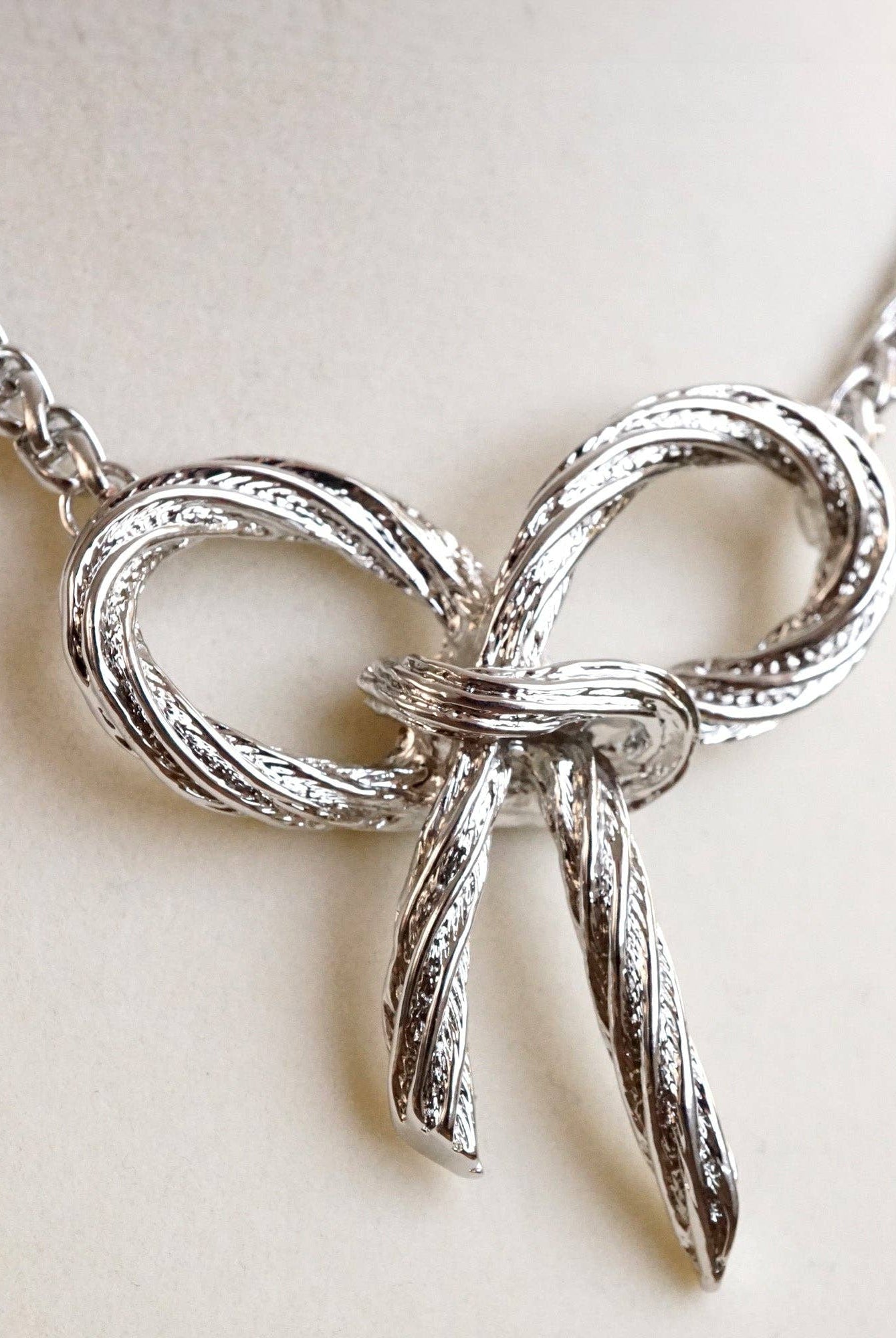 Large Rope Textured Bow Pendant Statement Necklace Silver Tone-Necklaces-PennyLine inc-Stuffology - Where Vintage Meets Modern, A Boutique for Real Women in Crosbyton, TX