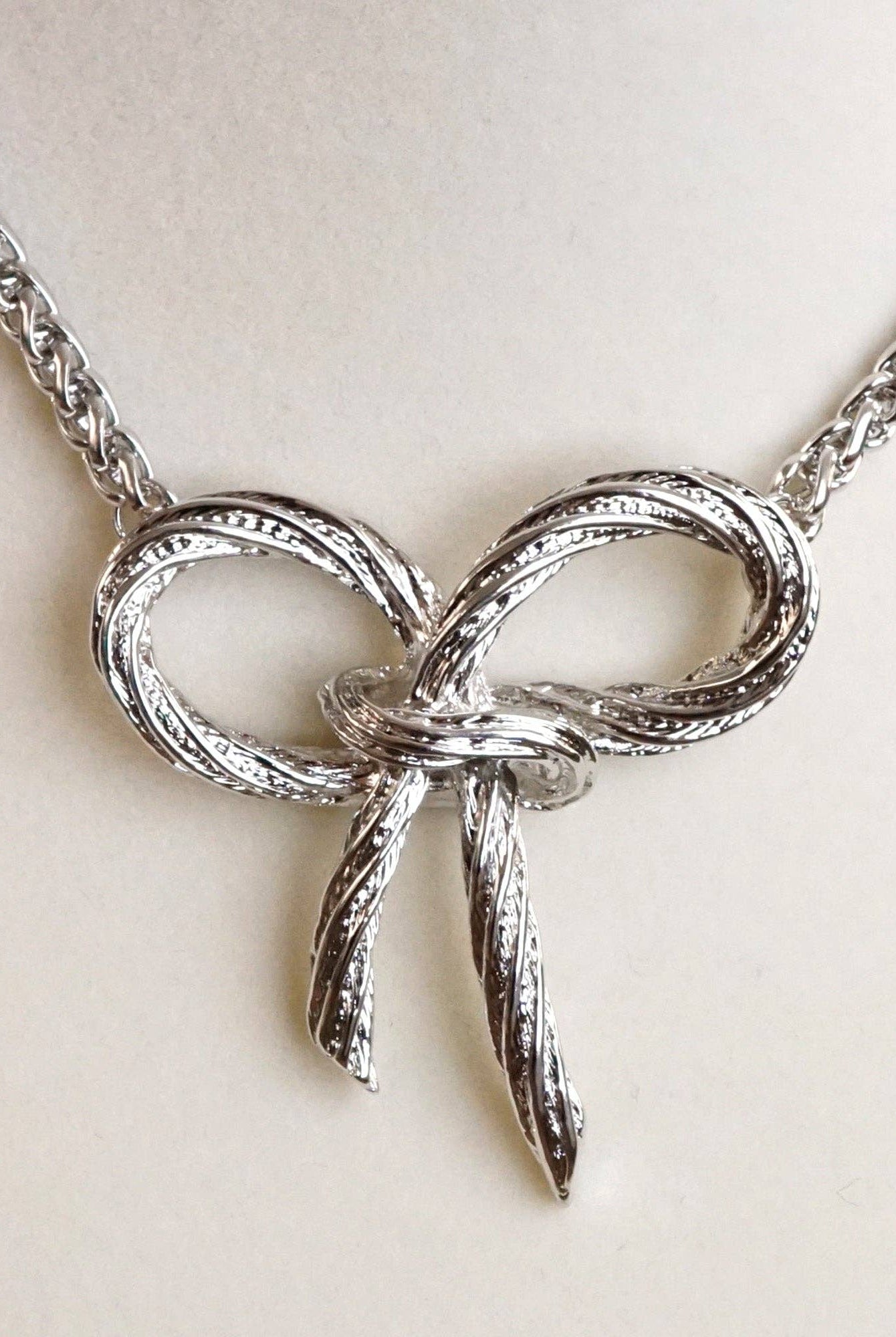 Large Rope Textured Bow Pendant Statement Necklace Silver Tone-Necklaces-PennyLine inc-Stuffology - Where Vintage Meets Modern, A Boutique for Real Women in Crosbyton, TX