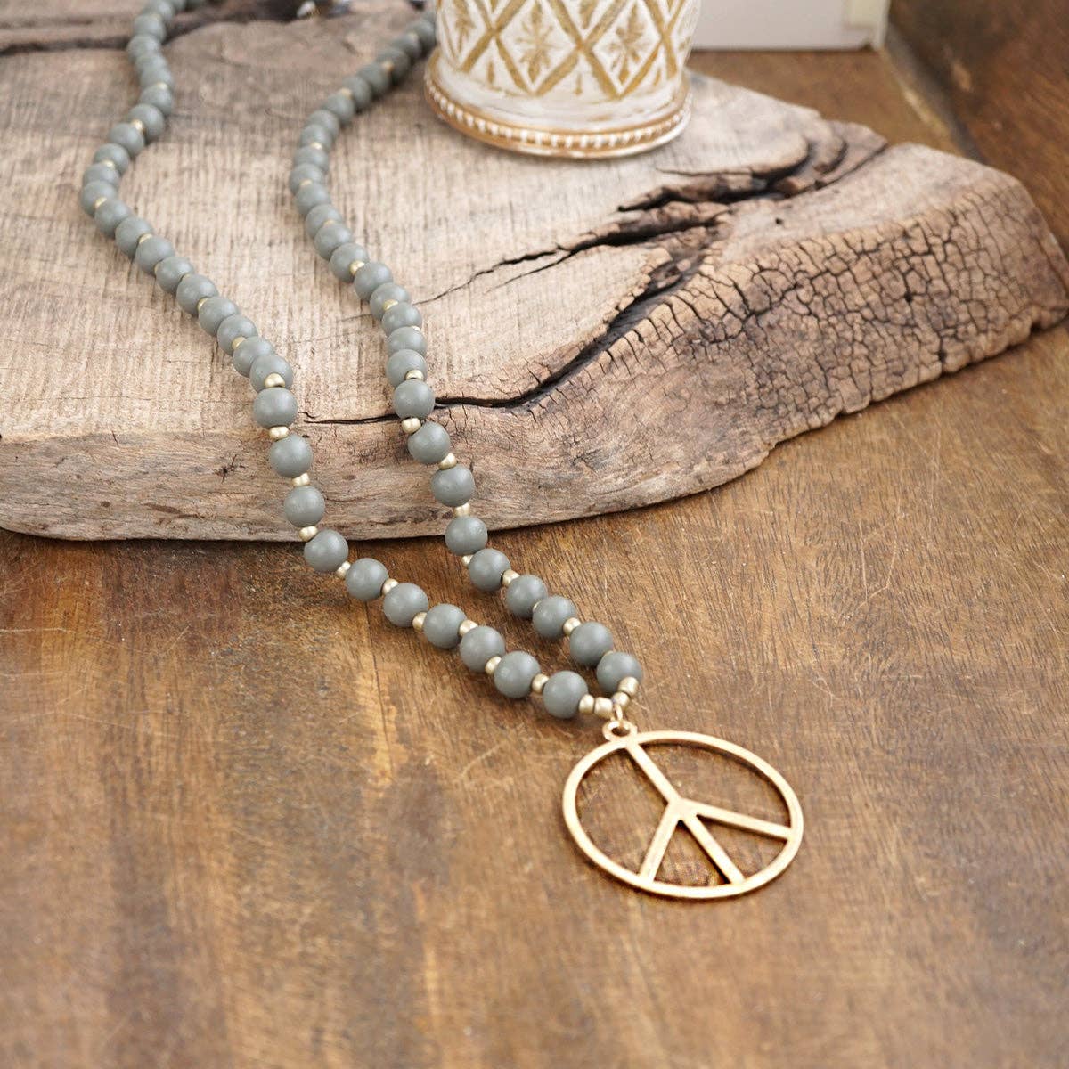 Long Wood Bead Necklace with golden peace sign pendant - Gray-Necklaces-PennyLine inc-Stuffology - Where Vintage Meets Modern, A Boutique for Real Women in Crosbyton, TX