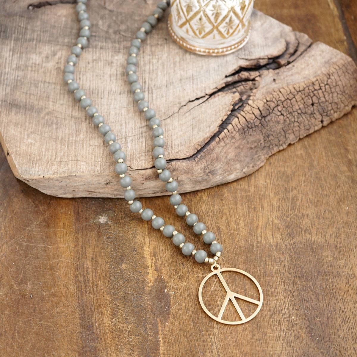 Long Wood Bead Necklace with golden peace sign pendant - Gray-Necklaces-PennyLine inc-Stuffology - Where Vintage Meets Modern, A Boutique for Real Women in Crosbyton, TX