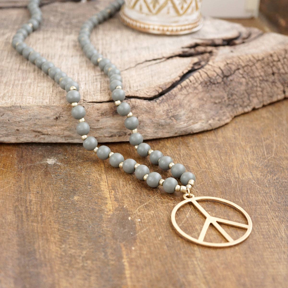 Long Wood Bead Necklace with golden peace sign pendant - Gray-Necklaces-PennyLine inc-Stuffology - Where Vintage Meets Modern, A Boutique for Real Women in Crosbyton, TX